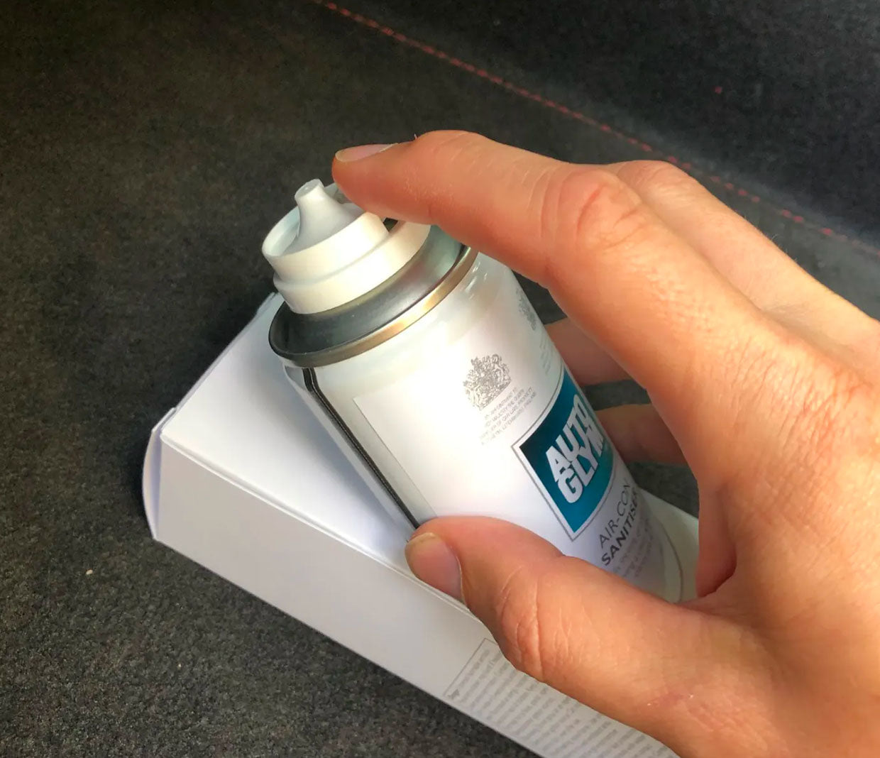Autoglym Air Con Sanitiser being inserted in to the box mount