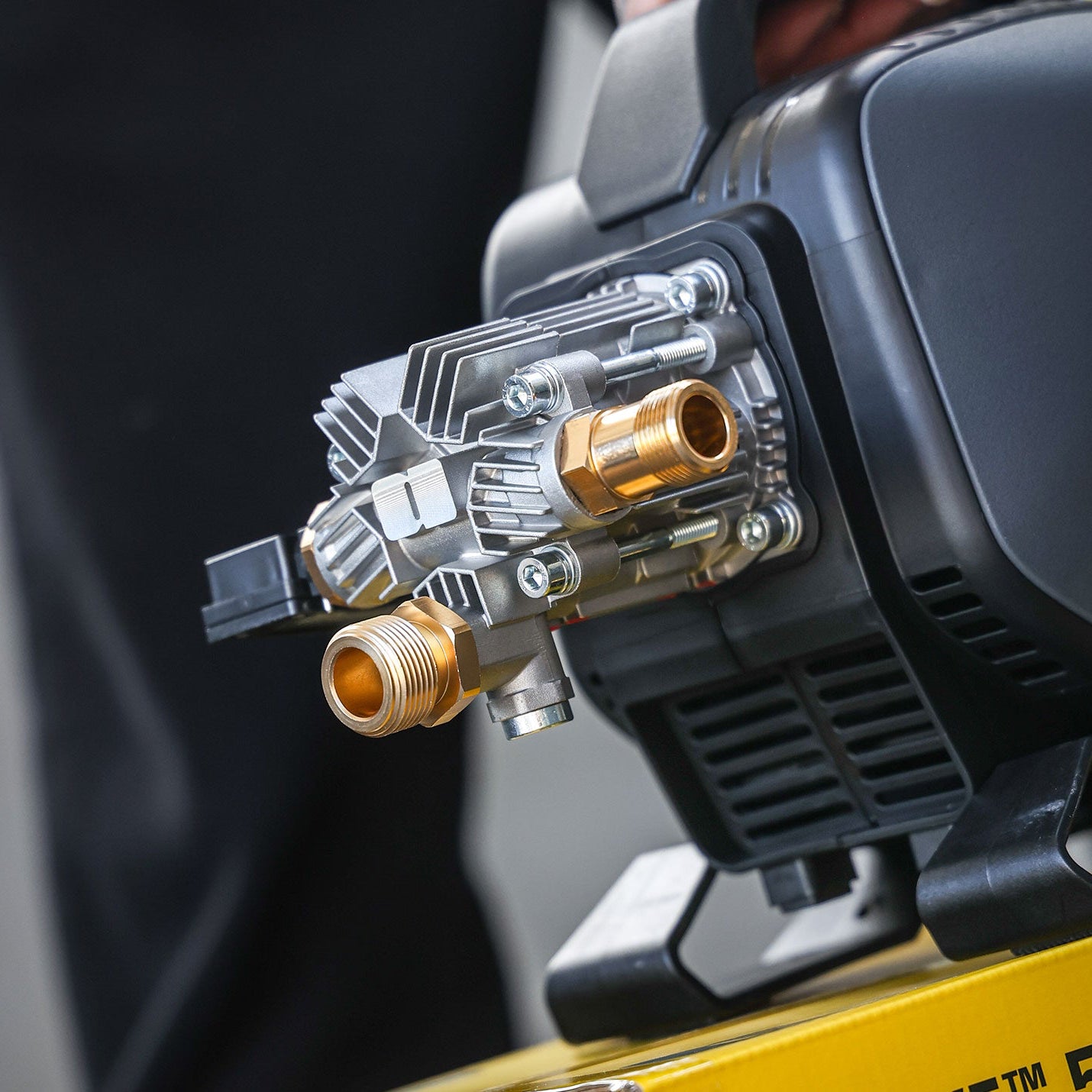 Close-up of a high-pressure washer nozzle on a blurred background